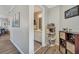 Hallway with hardwood floors and a view into the bathroom with vanity at 7725 Bold Springs Xing, Cumming, GA 30041