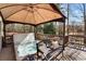 Relaxing hot tub under a gazebo on an outdoor deck with seating at 7725 Bold Springs Xing, Cumming, GA 30041