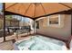 Outdoor deck with hot tub offers a luxurious spa experience at 7725 Bold Springs Xing, Cumming, GA 30041