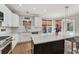 Beautiful kitchen boasts an island, hardwood floors, and modern stainless appliances at 7725 Bold Springs Xing, Cumming, GA 30041