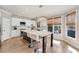 Modern kitchen boasts an island with barstool seating and stainless steel appliances at 7725 Bold Springs Xing, Cumming, GA 30041