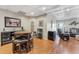 Open-concept living area features hardwood floors and elegant coffered ceiling at 7725 Bold Springs Xing, Cumming, GA 30041