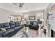 Living room showcases hardwood floors and open layout connecting to the kitchen at 7725 Bold Springs Xing, Cumming, GA 30041