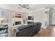 Cozy living room with hardwood floors, fireplace, and comfortable seating at 7725 Bold Springs Xing, Cumming, GA 30041