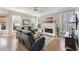 Bright living room features hardwood floors, fireplace, and multiple windows at 7725 Bold Springs Xing, Cumming, GA 30041