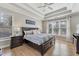 Bedroom features a trey ceiling, hardwood floors, and natural light at 7725 Bold Springs Xing, Cumming, GA 30041
