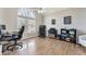 Bright home office with large window, hardwood floors, and space for multiple desks at 7725 Bold Springs Xing, Cumming, GA 30041