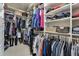 Organized walk-in closet with shelving and hanging rods providing ample storage at 7725 Bold Springs Xing, Cumming, GA 30041