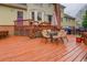 A spacious back deck features an outdoor dining table, grill, and convenient access to the home's back entrance at 802 Sugar Creek Se Dr, Conyers, GA 30094