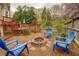 Fire pit and patio area are great for entertaining, nestled among trees and landscaping at 802 Sugar Creek Se Dr, Conyers, GA 30094