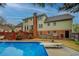 The backyard has a beautiful pool and an expansive deck, perfect for entertaining guests, and plenty of green space at 802 Sugar Creek Se Dr, Conyers, GA 30094