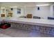 Custom basement bar with premium counters and plenty of space to entertain at 802 Sugar Creek Se Dr, Conyers, GA 30094