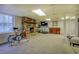 Finished basement is equipped with a fireplace, fitness equipment, and a television at 802 Sugar Creek Se Dr, Conyers, GA 30094