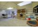 The finished basement has fireplace, entertainment center, and workout equipment at 802 Sugar Creek Se Dr, Conyers, GA 30094