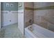 Bathroom with tiled walls, and a green patterned floor at 802 Sugar Creek Se Dr, Conyers, GA 30094