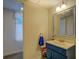 Basement bathroom has a blue vanity and updated fixtures, including a mirror and lighting at 802 Sugar Creek Se Dr, Conyers, GA 30094