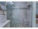 Custom shower with tile surround, built-in bench, and mosaic tile accents at 802 Sugar Creek Se Dr, Conyers, GA 30094