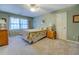 Relaxing bedroom provides carpeted floors, natural light, and neutral walls at 802 Sugar Creek Se Dr, Conyers, GA 30094