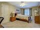 Comfortable bedroom with neutral colors, a ceiling fan, and ample natural light at 802 Sugar Creek Se Dr, Conyers, GA 30094