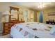 Bedroom featuring hardwood floors, a ceiling fan, and a double door closet at 802 Sugar Creek Se Dr, Conyers, GA 30094