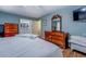 Spacious bedroom with wood floors, blue walls, and a view to the bath at 802 Sugar Creek Se Dr, Conyers, GA 30094