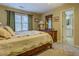Bedroom features a bed and access to the bathroom with natural light at 802 Sugar Creek Se Dr, Conyers, GA 30094