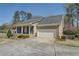 Charming home featuring a covered porch, stone accents, and a well-manicured front yard, enhancing its curb appeal at 802 Sugar Creek Se Dr, Conyers, GA 30094