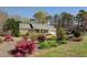 Lovely home with a well-manicured lawn and colorful landscaping, creating a warm and inviting curb appeal at 802 Sugar Creek Se Dr, Conyers, GA 30094
