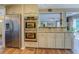Modern kitchen features stainless steel appliances, double ovens, and a view into the breakfast nook at 802 Sugar Creek Se Dr, Conyers, GA 30094