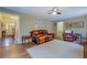 Inviting living room featuring hardwood floors, comfortable seating, and seamless flow to the entryway at 802 Sugar Creek Se Dr, Conyers, GA 30094