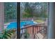 Backyard featuring a private in-ground pool and wooden deck, perfect for outdoor enjoyment at 802 Sugar Creek Se Dr, Conyers, GA 30094