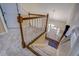 Carpeted staircase leading to a bright entryway with a chandelier and natural light at 802 Sugar Creek Se Dr, Conyers, GA 30094