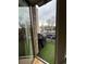 Balcony with artificial turf and grill, offering an outdoor living space with a view of the neighborhood at 1430 Dresden Dr # 225, Atlanta, GA 30319