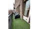 Balcony with artificial turf, grill with cover, and wrought iron railing at 1430 Dresden Dr # 225, Atlanta, GA 30319