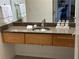 Bathroom vanity with granite countertop, modern sink, and storage cabinets at 1430 Dresden Dr # 225, Atlanta, GA 30319