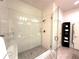 Modern bathroom featuring a glass-enclosed shower, subway tile, bench, and neutral color palette at 1430 Dresden Dr # 225, Atlanta, GA 30319