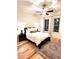 Cozy bedroom features a ceiling fan, two windows, and wood flooring at 1430 Dresden Dr # 225, Atlanta, GA 30319