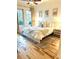 Bedroom with neutral colors, natural light, hardwood floors, a large bed and matching bedside tables at 1430 Dresden Dr # 225, Atlanta, GA 30319