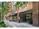 Facade of brick building featuring a private entrance for residences, and retail storefronts at 1430 Dresden Dr # 225, Atlanta, GA 30319