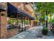Attractive brick building with J. Christopher's restaurant, featuring a blue awning and sidewalk appeal at 1430 Dresden Dr # 225, Atlanta, GA 30319