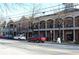 Charming street view featuring a row of mixed-use buildings with varied architectural styles and street parking at 1430 Dresden Dr # 225, Atlanta, GA 30319