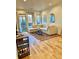 Cozy living room with large sectional couch, hardwood floors, modern lighting and outside views at 1430 Dresden Dr # 225, Atlanta, GA 30319