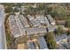 A high-angle aerial view of an upscale neighborhood with townhomes, mature trees and easy access to local highways at 2120 Sonoma Se Dr, Smyrna, GA 30080