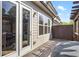 View of the back deck featuring double glass doors and a wooden pergola with a fence for privacy at 2120 Sonoma Se Dr, Smyrna, GA 30080