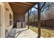 View of the covered patio and fenced backyard with two HVAC units, providing a space for relaxation and entertainment at 2120 Sonoma Se Dr, Smyrna, GA 30080