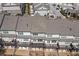Aerial view of townhome community backyards featuring private decks, neutral color scheme, and well-maintained landscapes at 2120 Sonoma Se Dr, Smyrna, GA 30080