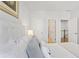 Bright bedroom features a plush bed and art with easy access to other rooms in the house at 2120 Sonoma Se Dr, Smyrna, GA 30080