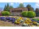 Lylebrooke community entrance with colorful flowers and lush greenery, creating a welcoming and attractive environment at 2120 Sonoma Se Dr, Smyrna, GA 30080
