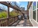 Wooden deck with pergola, railing, and two covered grills at 2120 Sonoma Se Dr, Smyrna, GA 30080