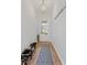 A well-lit entryway offers storage for shoes and coats, leading into the home with stylish light fixtures at 2120 Sonoma Se Dr, Smyrna, GA 30080